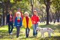 Family walking in autumn park. Fall fun Royalty Free Stock Photo