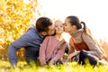 Family walking in autumn park at sunset Royalty Free Stock Photo