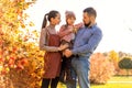 Family walking in autumn park at sunset Royalty Free Stock Photo