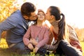 Family walking in autumn park at sunset Royalty Free Stock Photo