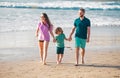 Family walking on beach. Mother father and child son spending time together. Family summer vacation. Parent dad mom Royalty Free Stock Photo