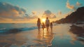 a family is walking on the beach at sunset Royalty Free Stock Photo