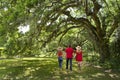 Family walking in the beautiful park on spring morning.