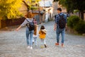 Family walking down the street of old city Royalty Free Stock Photo