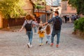 Family walking down the street of old city Royalty Free Stock Photo