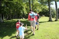 Family walking in forest going camping Royalty Free Stock Photo