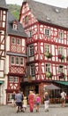 Family walking in medieval village cobblestone street Royalty Free Stock Photo