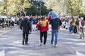 Family walking and mother with the Spanish flag