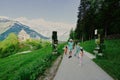 Family walking near mirror cube at path to caves Mount Krippenstein in Hallstatt, Upper Austria, Europe