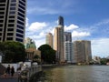 Family walking on a riverside promenade in Brisbane