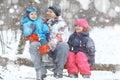 Family walking in snowy park Royalty Free Stock Photo