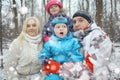 Family walking in snowy park Royalty Free Stock Photo