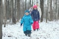 Family walking in snowy park Royalty Free Stock Photo