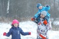 Family walking in snowy park Royalty Free Stock Photo