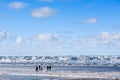 Family walking to sea ice wimp stack in the sea. Royalty Free Stock Photo