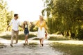 Family Walking Together Holding Hands In Nature Going On Picnic Royalty Free Stock Photo