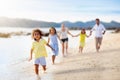 Family walking on tropical beach Royalty Free Stock Photo