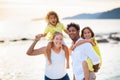 Family walking on tropical beach Royalty Free Stock Photo