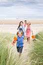 Family walking up the sand dunes Royalty Free Stock Photo