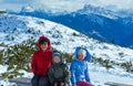 Family walking on winter mountain slope Royalty Free Stock Photo
