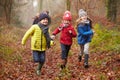 Family Walking Through Winter Woodland