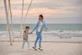 Mom and son on the beach.