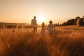 A family walks through a field at sunset Generative AI