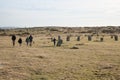 A family walks past the Hurler\'s Stones on Bodmin Moor, Cornwall in the UK