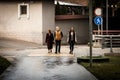 A family walks through a pedestrian crossing along Terrenkur alley in Almaty Royalty Free Stock Photo