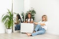 Family warm up hands over electric heater