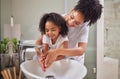 Family, washing hands and child with mom rinsing, cleaning and good hygiene against bacteria or germs for infection or Royalty Free Stock Photo