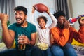 Family watching american football match on television Royalty Free Stock Photo