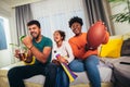 Family watching american football match on television Royalty Free Stock Photo