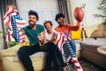 Family watching american football match on television at home Royalty Free Stock Photo