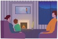 Family watching Television together on a cold night