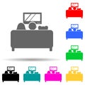 family watching TV on the couch multi color style icon. Simple glyph, flat vector of family icons for ui and ux, website or mobile Royalty Free Stock Photo