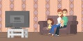 Family watching tv in the living room Royalty Free Stock Photo