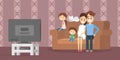 Family watching tv in the living room Royalty Free Stock Photo