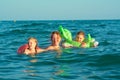 Family in the waves Royalty Free Stock Photo