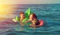 Family in the waves Royalty Free Stock Photo