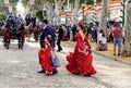 Family wearing traditional flamenco dress enjoying at the April Fair Feria de Abril, Seville Royalty Free Stock Photo