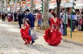 Family wearing traditional flamenco dress enjoying at the April Fair Feria de Abril, Seville Royalty Free Stock Photo