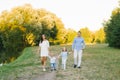 Family weekend: a beautiful young family with a small son and daughter walk outdoors Royalty Free Stock Photo