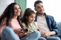 Family Weekend. Happy Arab Parents And Child Playing Video Games At Home Royalty Free Stock Photo