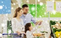 Family weighing oranges on scale at grocery store Royalty Free Stock Photo