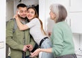 Family welcoming and embracing man who came after work trip Royalty Free Stock Photo