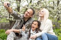 Family Welcoming Husband Home On Army Leave. Royalty Free Stock Photo