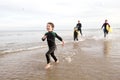 Family in Wetsuits Royalty Free Stock Photo