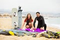 Family in wetsuits with surf boards Royalty Free Stock Photo