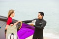 Family in wetsuits with surf boards Royalty Free Stock Photo